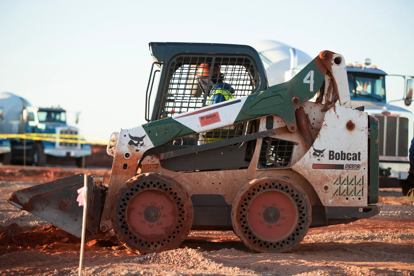 CEI skid steer on a commercial concrete site